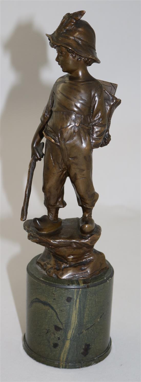 Paul Ludwig Kowalczewski (German, 1865-1910). A bronze figure of a boy wearing a backpack, overall H.11in.